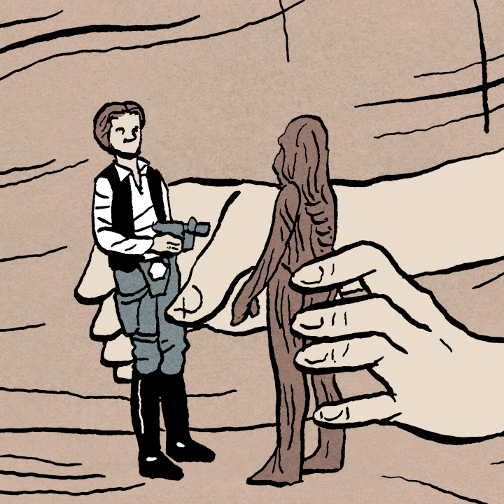 child's hands playing with Han Solo and Chewbacca toys