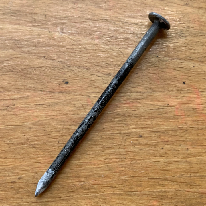 image of an ink encrusted nail