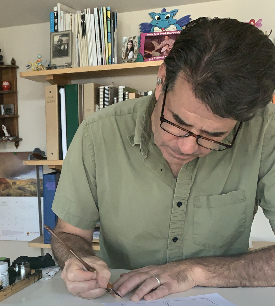 Nick Mullins inking at drawing table